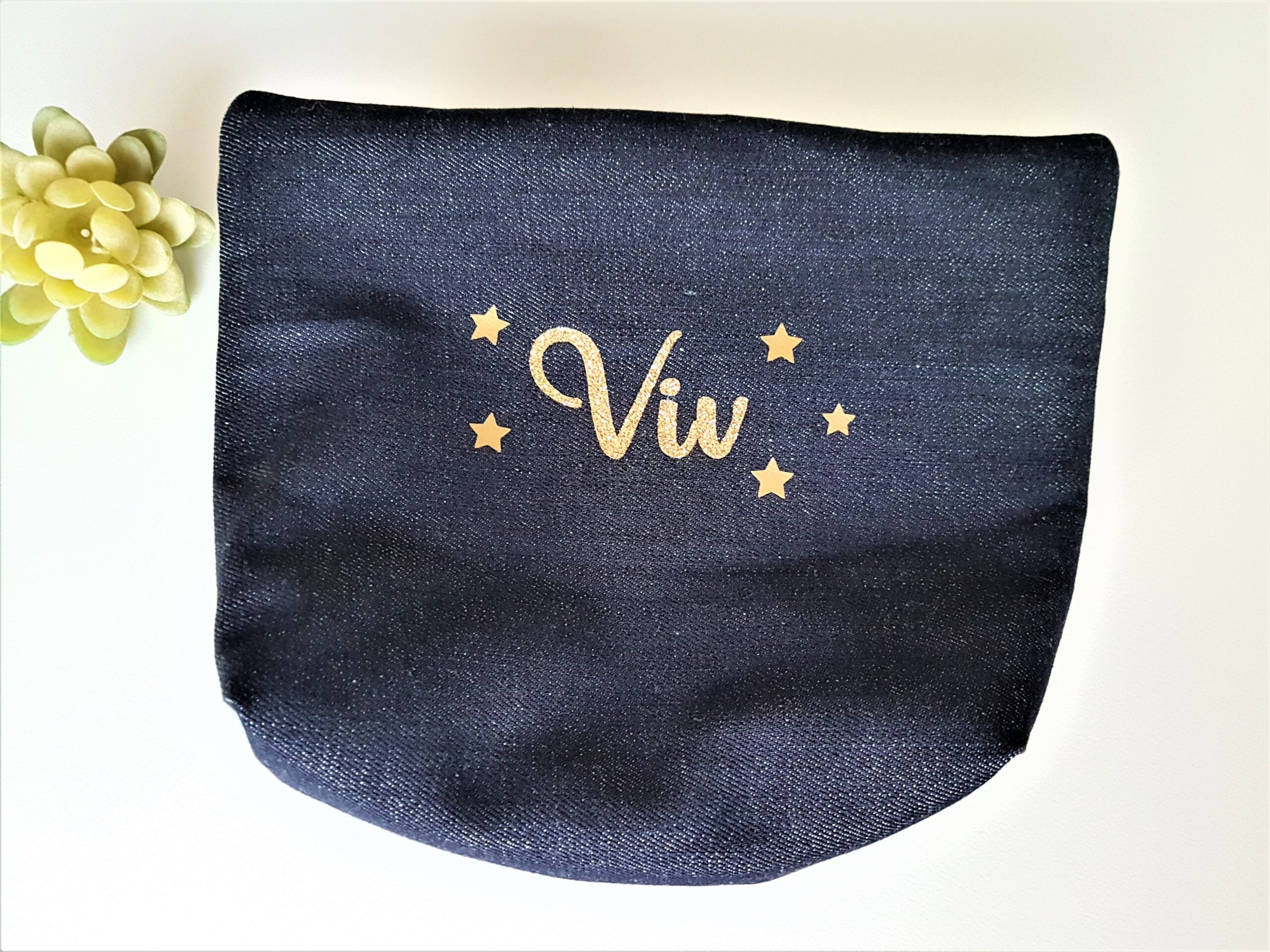 Denim cosmetic bag with base