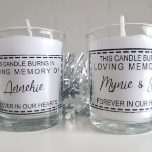 White votive candle in a customised glass container