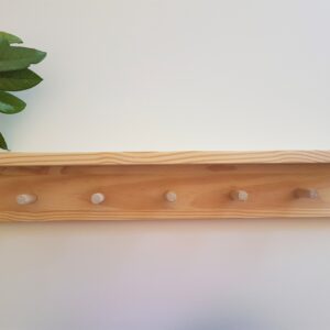 Wooden shelf with dowel hooks
