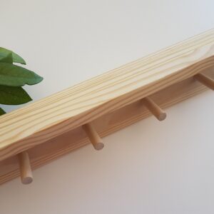 Wooden shelf with dowel hooks
